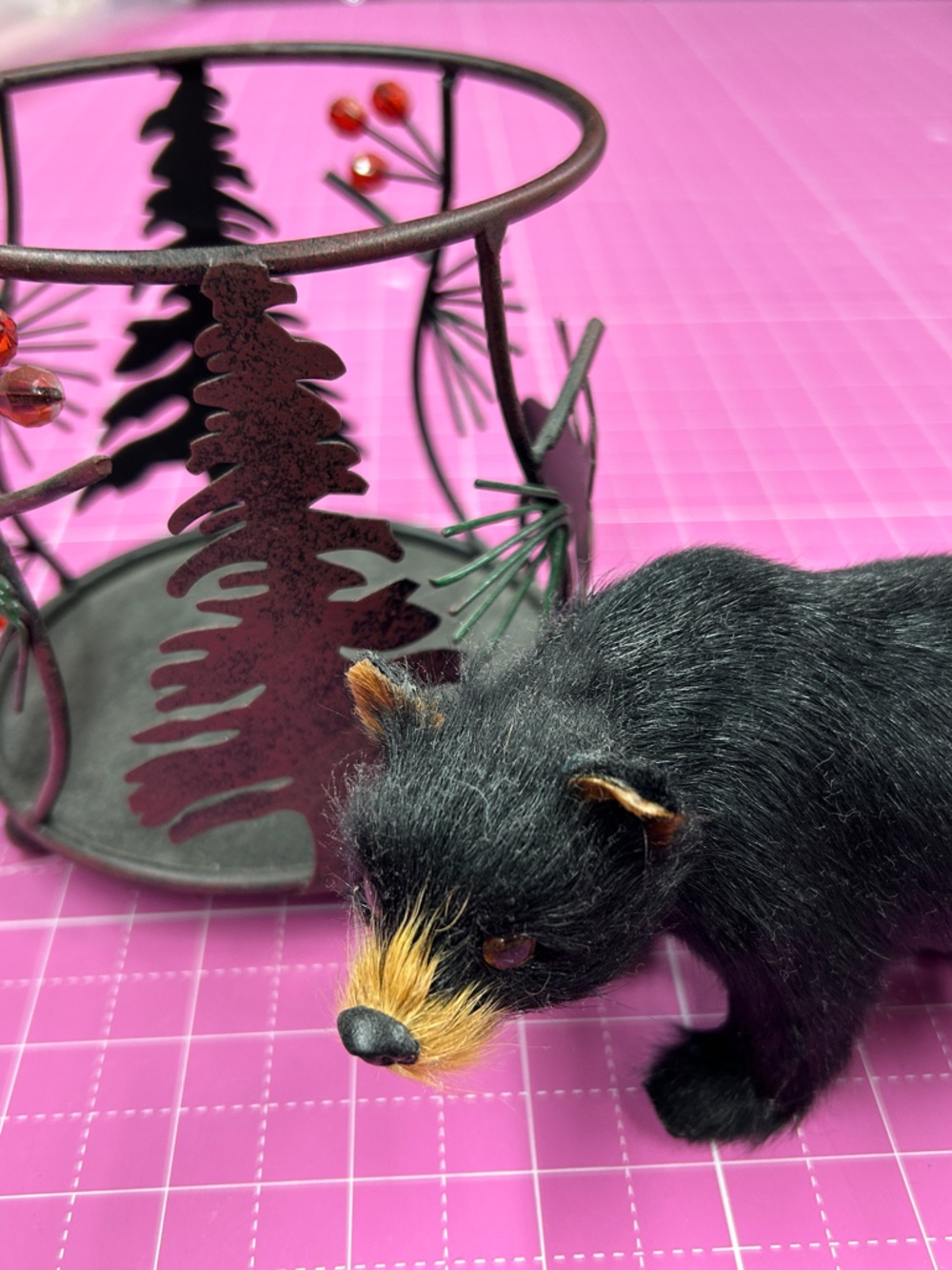 Candle holder and bear figurine